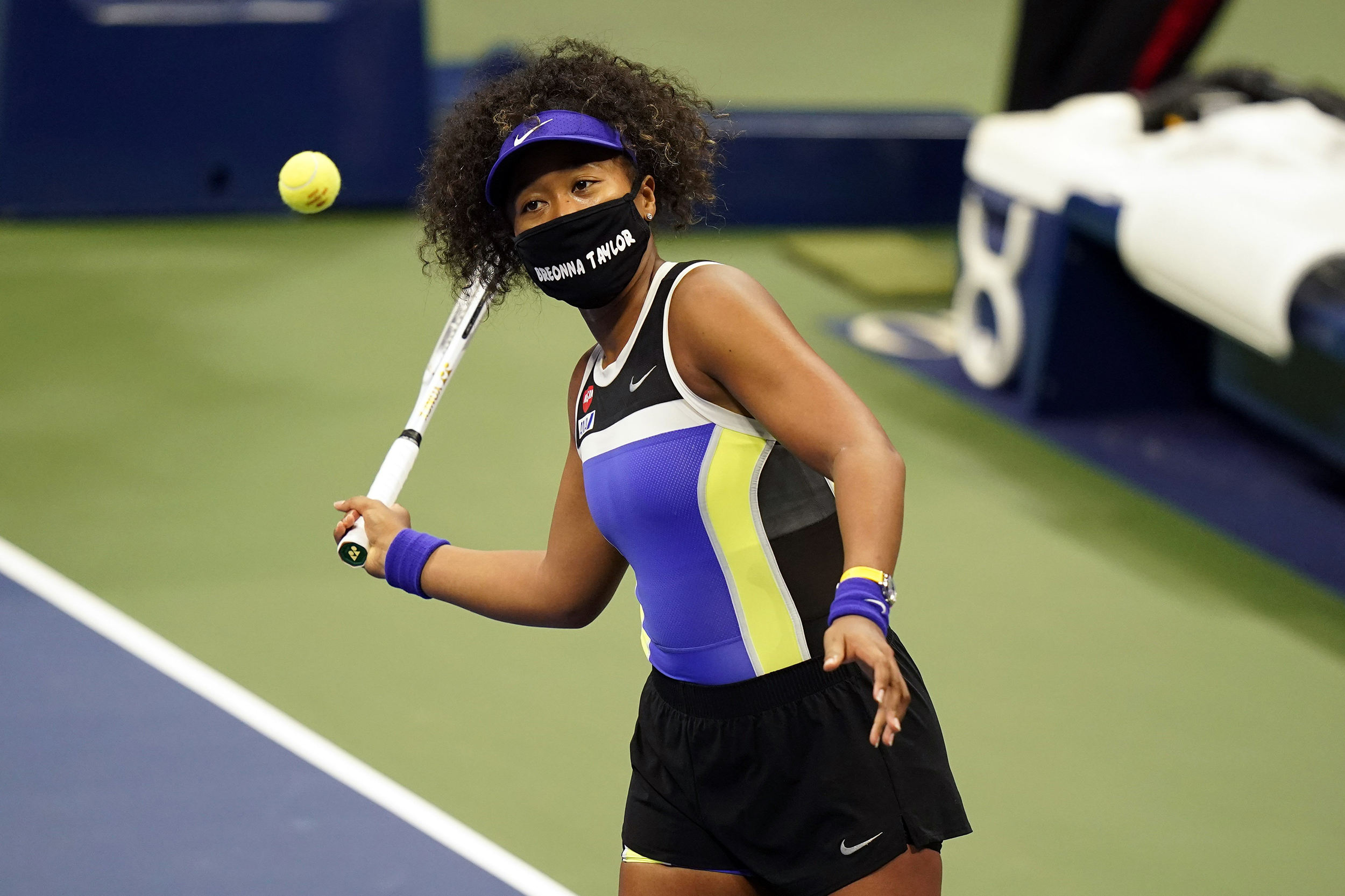 A person hitting a ball with a racket