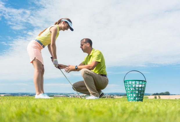 A man that is sitting in the grass