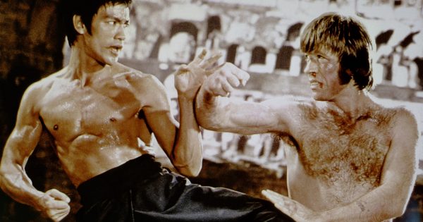 Bruce Lee holding a baby