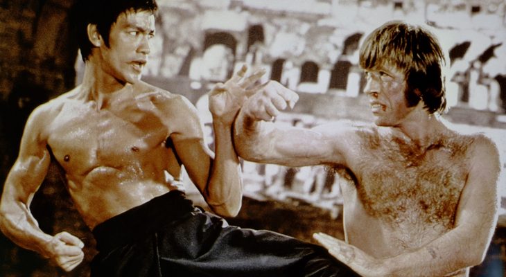 Bruce Lee holding a baby