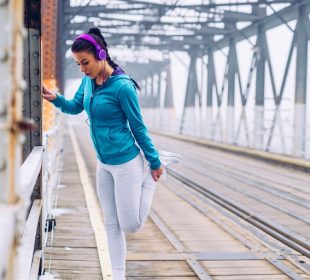 A girl doing workout with listing music