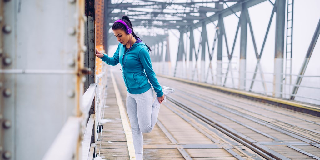 A girl doing workout with listing music
